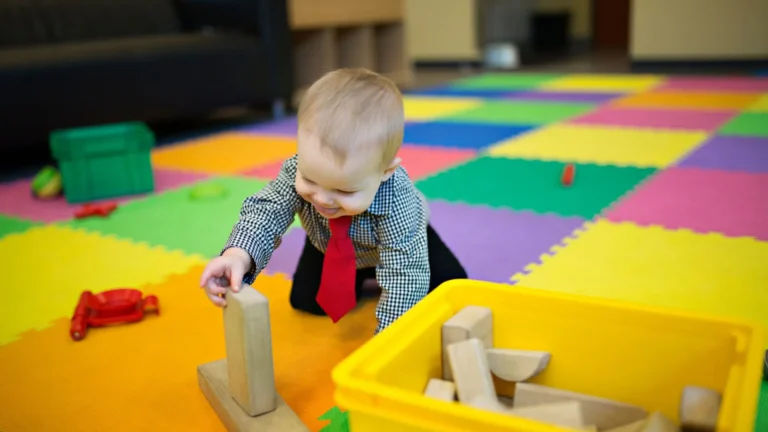 An image of 6-9 months baby playing with a toy