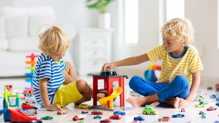 An image of 3 year old playing with toys