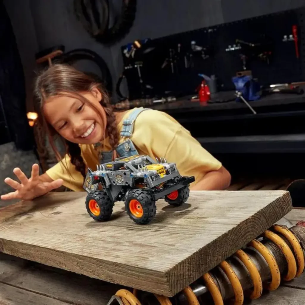 An image of A toddler playing with kids Lego set