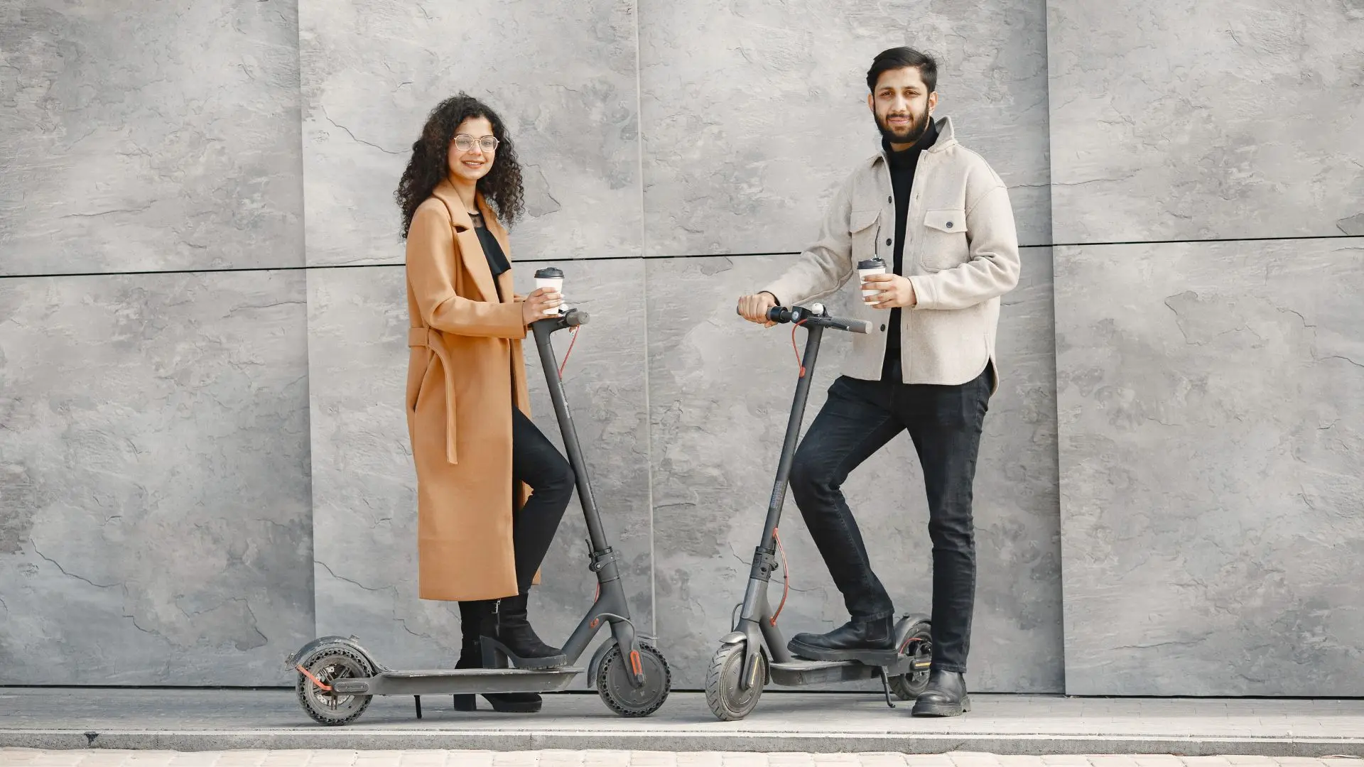 An image of Adults Riding scooters