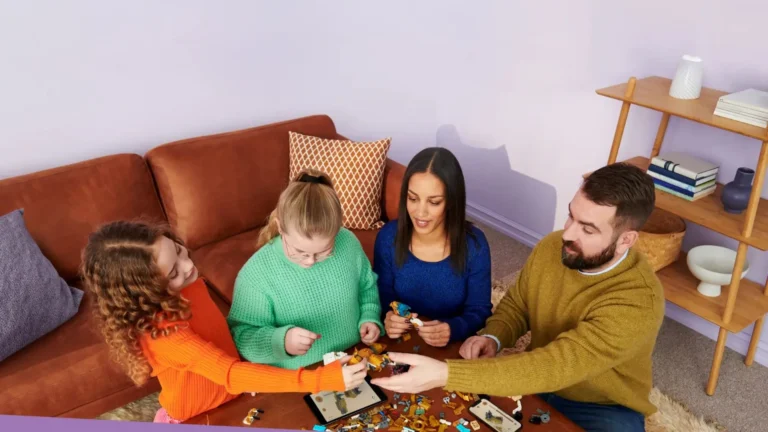 An Image of Family Playing with Lego Sets