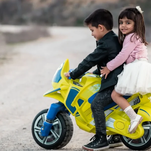 An image of Toddlers playing with a ride on toy outdoor