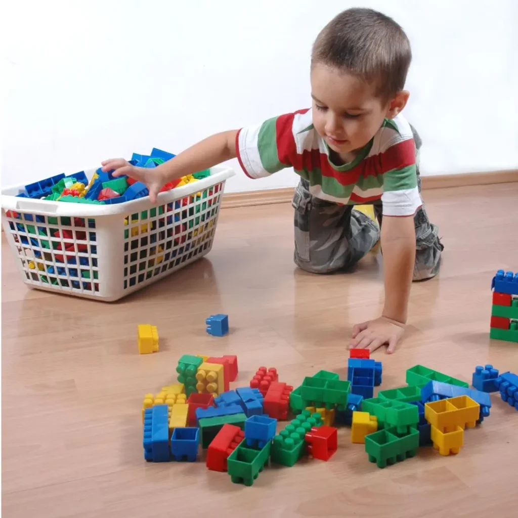 An image of a child arranging toys on a toy organizer